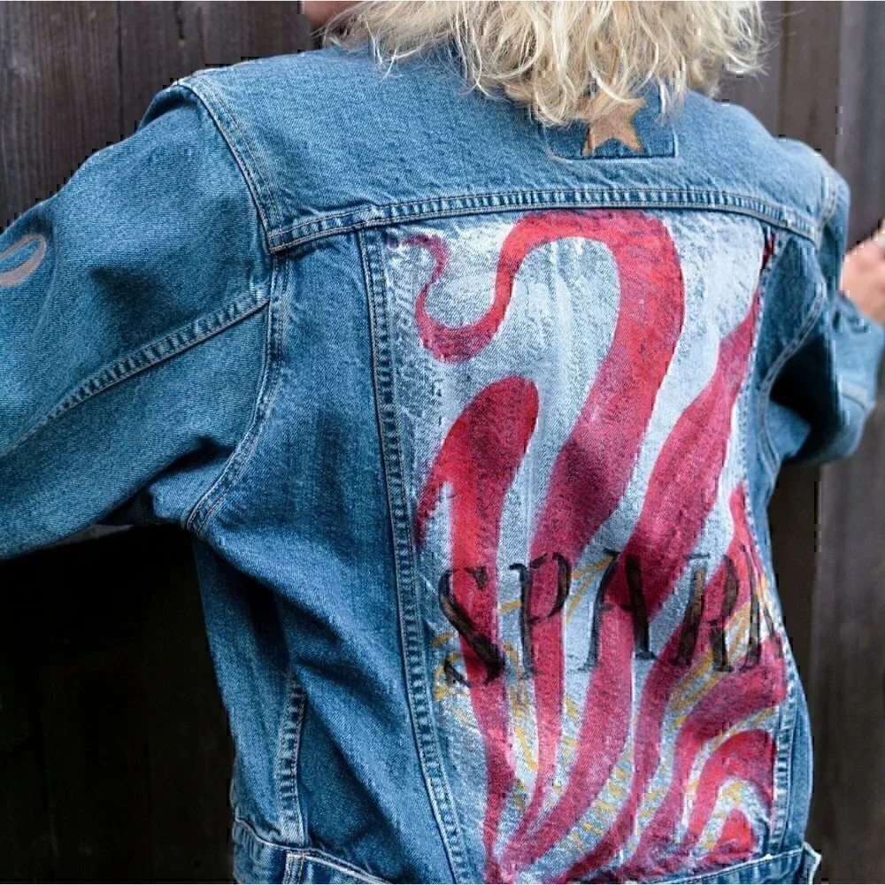 Vintage faded denim classic jean jacket. Retro cut with hand painted images